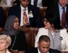  SENSITIVE MATERIAL. THIS IMAGE MAY OFFEND OR DISTURB U.S. Representative Rashida Tlaib (D-MI) wears a "Fuck ICE" pin as she sits next to U.S. Representative Ilhan Omar (D-MN) during U.S. President Donald Trump's State of the Union address to a joint session of Congress at the U.S. Capitol in Washington, D.C., U.S., February 24, 2026. REUTERS/Evelyn Hockstein/Evelyn Hockstein