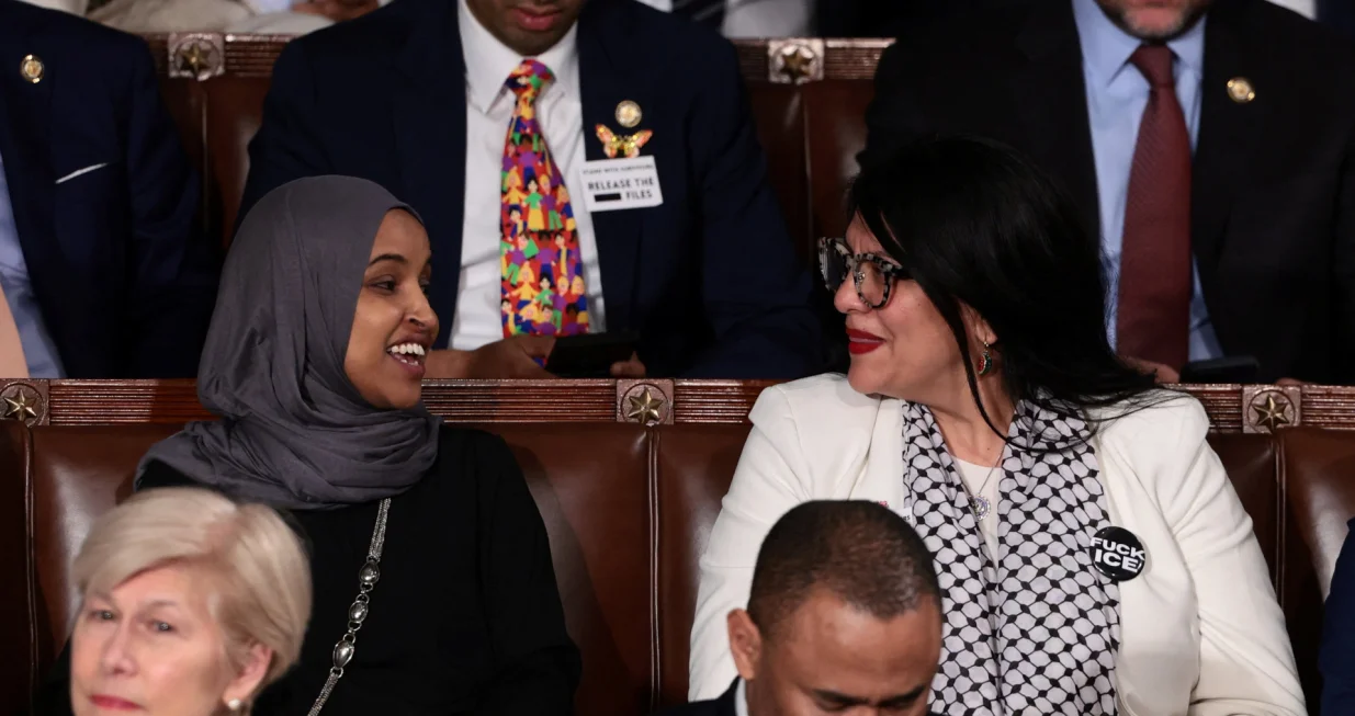  SENSITIVE MATERIAL. THIS IMAGE MAY OFFEND OR DISTURB U.S. Representative Rashida Tlaib (D-MI) wears a "Fuck ICE" pin as she sits next to U.S. Representative Ilhan Omar (D-MN) during U.S. President Donald Trump's State of the Union address to a joint session of Congress at the U.S. Capitol in Washington, D.C., U.S., February 24, 2026. REUTERS/Evelyn Hockstein/Evelyn Hockstein