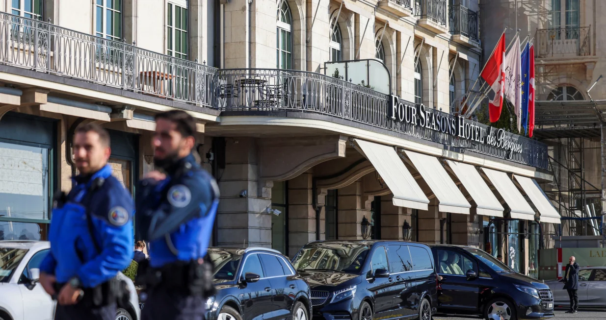 Police officers stand in front of the Four Seasons Hotel des Bergues Geneva as they secure the city on the day of U.S.-mediated peace talks between Russia and Ukraine, in Geneva, Switzerland, February 26, 2026. REUTERS/Pierre Albouy/Pierre Albouy
