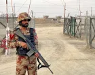 An army soldier stands guard at a deserted entry point at the Friendship Gate, following the exchanges of fire between Pakistan and Afghanistan forces, at the border crossing between the two countries, in Chaman, Pakistan February 27, 2026. Picture taken with a mobile phone. REUTERS/Abdul Khaliq Achakzai/Abdul Khaliq Achakzai