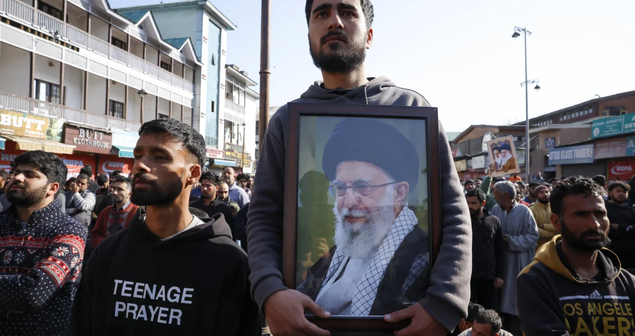 A Shiite Muslim man holds a photo of Iran's Supreme Leader Ayatollah Ali Khamenei, as they protest after Khamenei was killed in Israeli-U.S. strikes on Saturday, in Srinagar, Indian Kashmir March 1, 2026. REUTERS/Sharafat Ali/Sharafat Ali