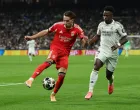 Soccer Football - UEFA Champions League - Play Off - Second Leg - Real Madrid v Benfica - Santiago Bernabeu, Madrid, Spain - February 25, 2026 Real Madrid's Vinicius Junior in action with Benfica's Amar Dedic REUTERS/Violeta Santos Moura/Foto: Violeta Santos Moura