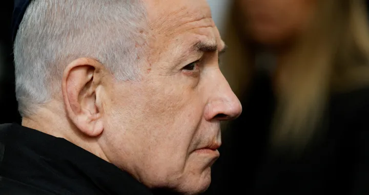 FILE PHOTO: Israeli Prime Minister Benjamin Netanyahu attends a memorial service held for Ran Gvili, an off-duty police officer who was killed fighting militants that had infiltrated Israel during the deadly October 7, 2023, attack by Hamas, and the last hostage recovered from Gaza, in Meitar, Israel, January 28, 2026. REUTERS/Amir Cohen/File Photo/Amir Cohen