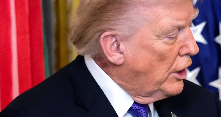 A patch of blemished skin is visible over U.S. President Donald Trump's shirt collar during a Medal of Honor ceremony at the White House in Washington, D.C., U.S., March 2, 2026. REUTERS/Jonathan Ernst/Jonathan Ernst