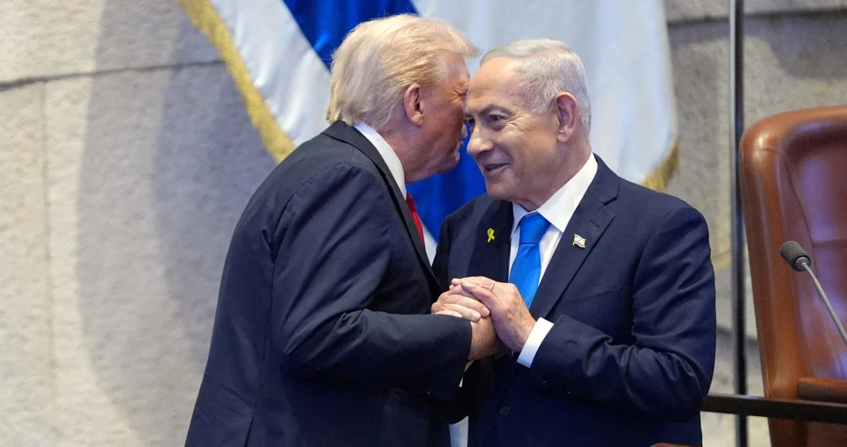 FILE PHOTO: President Donald Trump talks with Israel's Prime Minister Benjamin Netanyahu at the Knesset, Monday, Oct. 13, 2025, in Jerusalem.  Evan Vucci/Pool via REUTERS/File Photo/Evan Vucci