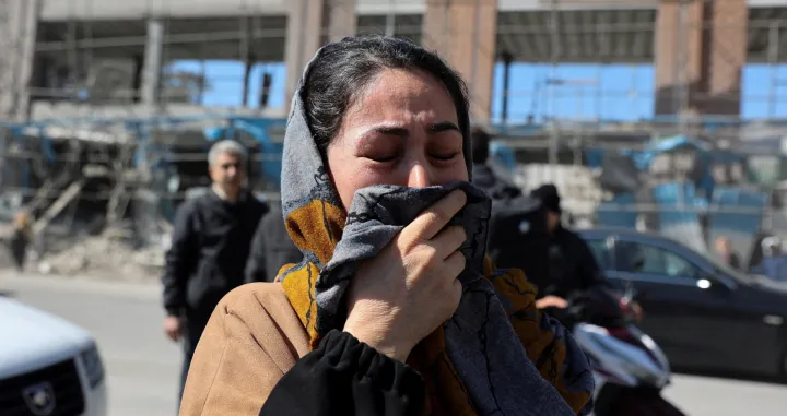 A woman reacts on the street following an Israeli and U.S. strike on a police station, amid the U.S.-Israeli conflict with Iran, in Tehran, Iran, March 3, 2026. Majid Asgaripour/WANA (West Asia News Agency) via REUTERS ATTENTION EDITORS - THIS PICTURE WAS PROVIDED BY A THIRD PARTY  TPX IMAGES OF THE DAY/Majid Asgaripour