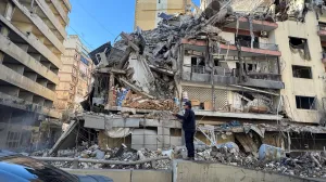 A man stands near a damaged building after Israeli strikes on Beirut's southern suburbs on Wednesday, following renewed hostilities between Hezbollah and Israel amid the U.S.-Israeli conflict with Iran, Lebanon, March 5, 2026. Picture taken with a mobile phone. REUTERS/Ahmad Al Kerdi/Ahmad Al Kerdi