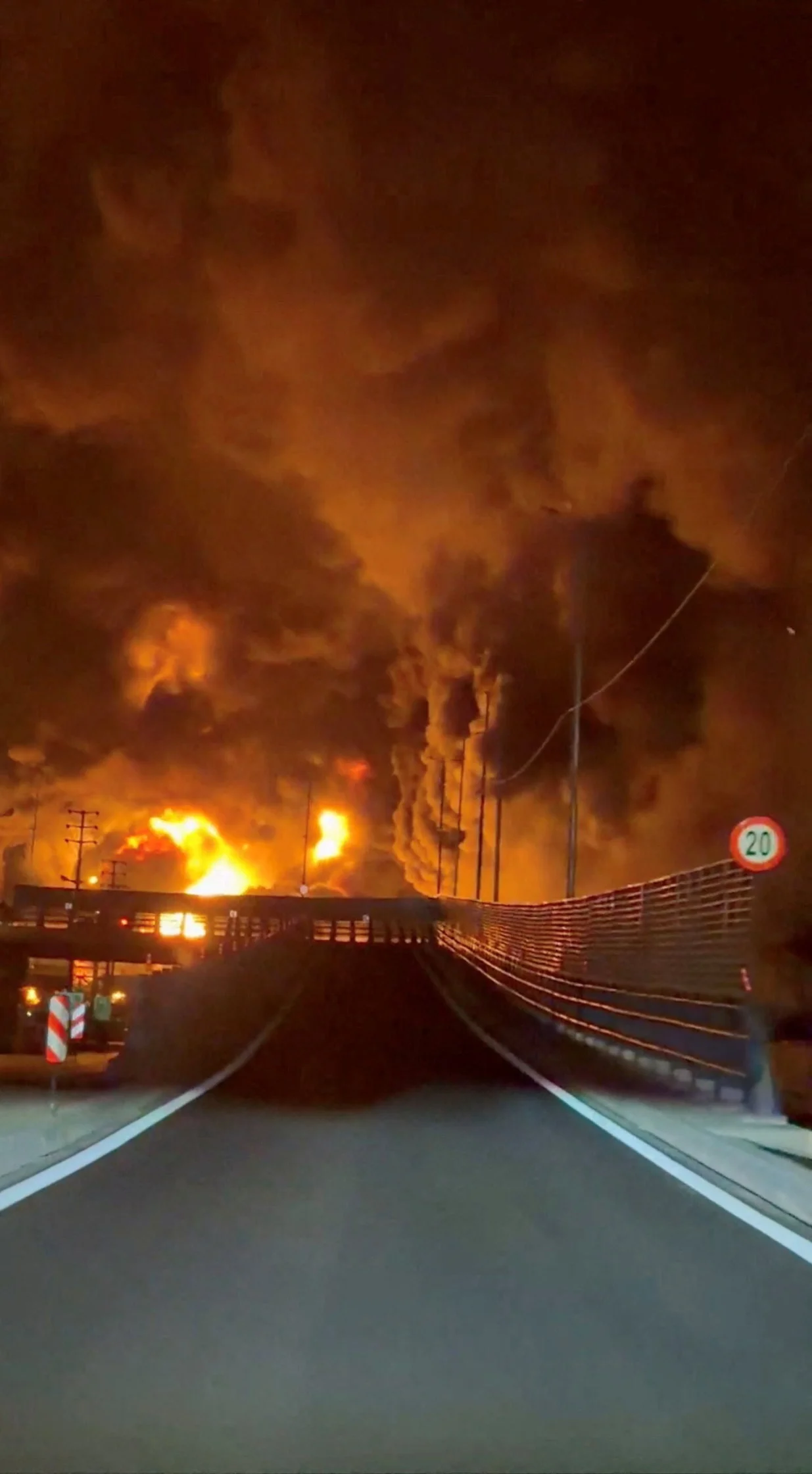 Fire burns and smoke rises from Aqdasieh Oil Depot after being reportedly hit by strike, amid the U.S.-Israeli conflict with Iran, in Tehran, Iran in this screengrab taken from a social media video released on March 8, 2026. SOCIAL MEDIA/via REUTERS THIS IMAGE HAS BEEN SUPPLIED BY A THIRD PARTY. NO RESALES. NO ARCHIVES. VERIFICATION: Reuters confirmed the location as Tehran by the road layout, utility poles and trees which match file and satellite imagery. The date of the video could not be verified, but no older version was found posted online before March 8. Israeli military also wrote on Telegram that it had struck a number of fuel storage facilities in Tehran on March 8. Iran's state agencies reported attacks on a number of oil depots on March 7. NASA FIRMS detected thermal activity on coordinate 35.790649529257415, 51.539333520742645 at 1:50 a.m. on March 8 (10:20 p.m. UTC March 7). The coordinates were tagged as Petrol Storage Aqdasieh on the online map./Social Media