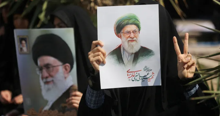 FILE PHOTO: A woman gestures while holding an image of Iran's late Supreme Leader Ayatollah Ali Khamenei, on the day of an anti-Israeli and U.S. rally, amid the U.S.-Israeli conflict with Iran, in Tehran, Iran, March 6, 2026. Majid Asgaripour/WANA (West Asia News Agency) via REUTERS ATTENTION EDITORS - THIS PICTURE WAS PROVIDED BY A THIRD PARTY/File Photo/Majid Asgaripour