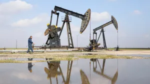 A man walks next to pumpjacks on the day a Syrian government delegation visits the oil-rich city of Rmelan to inspect oil fields and finalise agreements signed between the Syrian government and the Syrian Democratic Forces (SDF), in Rmelan, Syria, February 9, 2026. REUTERS/Orhan Qereman/Orhan Qereman