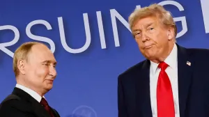 FILE PHOTO: U.S. President Donald Trump looks on next to Russian President Vladimir Putin during a press conference following their meeting to negotiate an end to the war in Ukraine, at Joint Base Elmendorf-Richardson, in Anchorage, Alaska, U.S., August 15, 2025. REUTERS/Kevin Lamarque  TPX IMAGES OF THE DAY/File Photo/Kevin Lamarque