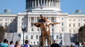 People look at a statue depicting U.S. President Donald Trump and convicted sex offender Jeffrey Epstein, entitled "The King of the World", on the National Mall in Washington, D.C., U.S., March 10, 2026. REUTERS/Evelyn Hockstein/Evelyn Hockstein