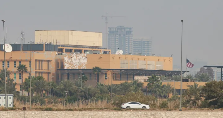 A car moves past the U.S. Embassy, after Iraqi security sources said the embassy was hit in a missile attack, in Baghdad, Iraq, March 14, 2026,. REUTERS/Ahmed Saad/Ahmed Saad