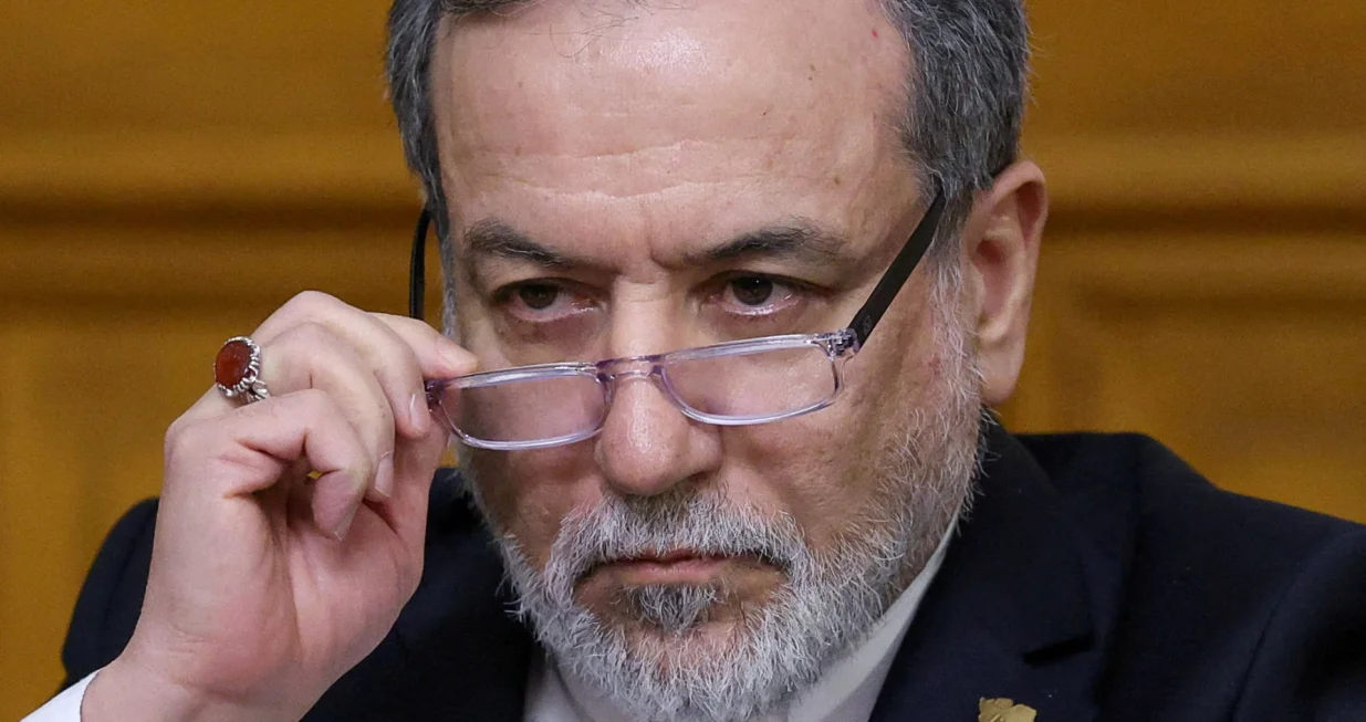 FILE PHOTO: Iranian Foreign Minister Abbas Araqchi adjusts glasses during a press conference following talks with Russian Foreign Minister Sergei Lavrov in Moscow, Russia, December 17, 2025. REUTERS/Ramil Sitdikov/Pool/File Photo/Ramil Sitdikov