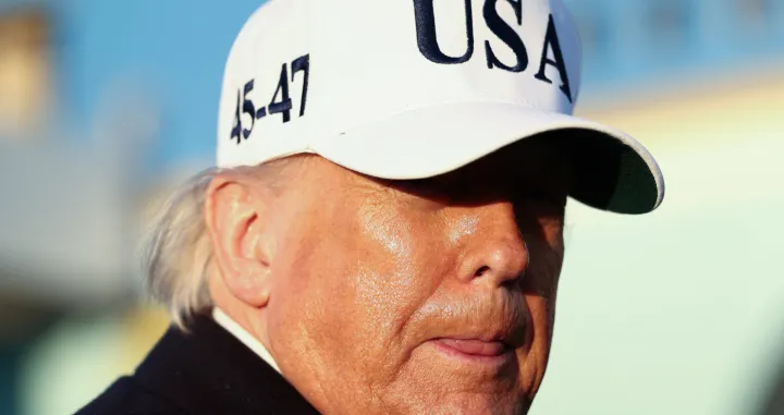 U.S. President Donald Trump looks on before boarding Air Force One for travel to Florida, at Joint Base Andrews, Maryland, U.S., March 13, 2026. REUTERS/Kevin Lamarque/Kevin Lamarque