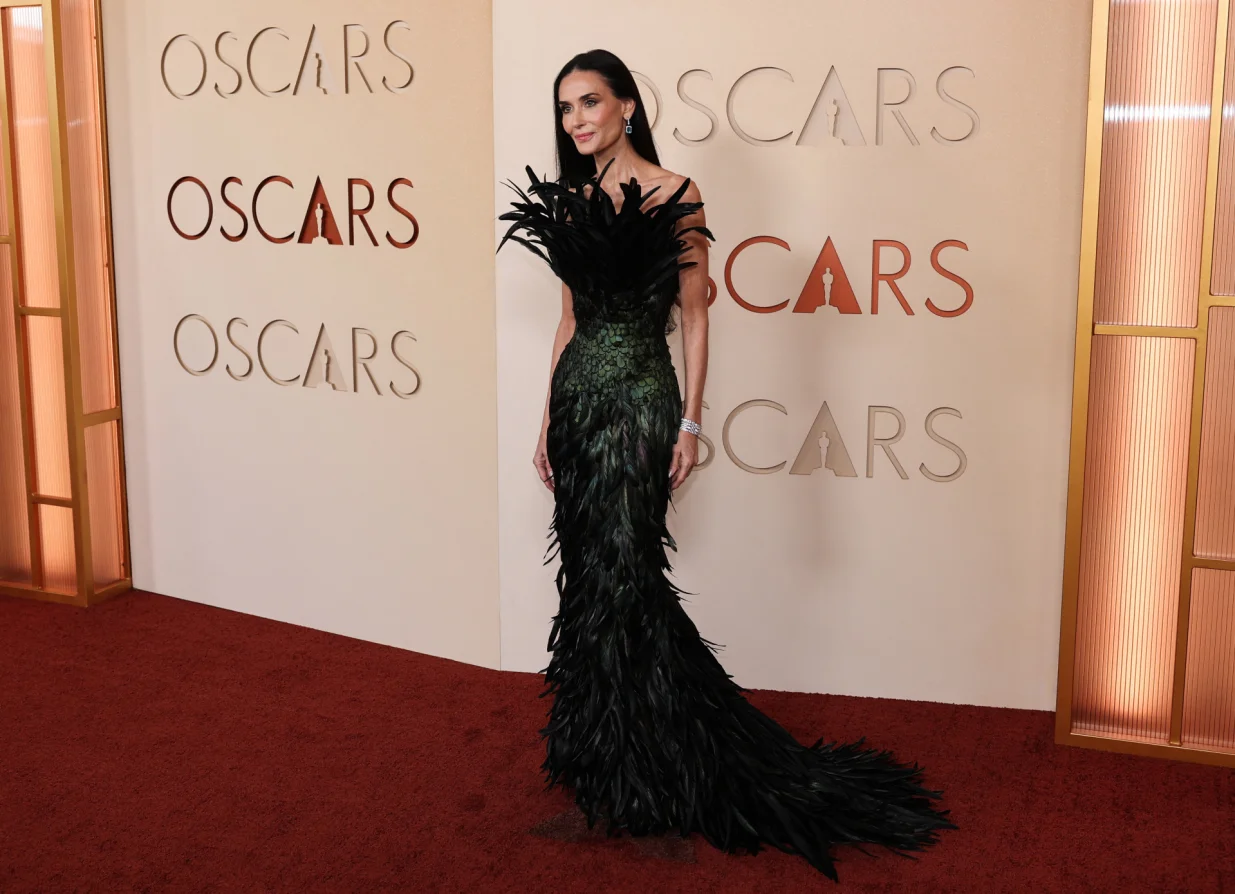 Demi Moore poses on the red carpet during the Oscars arrivals at the 98th Academy Awards in Hollywood, Los Angeles, California, U.S., March 15, 2026. REUTERS/Daniel Cole/Daniel Cole