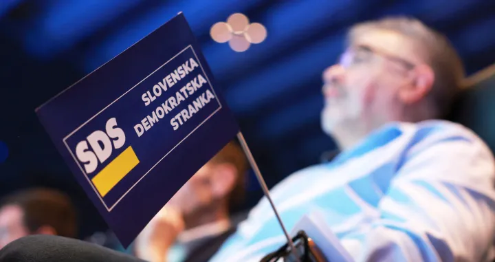 A miniature flag with the logo of the Slovenian Democratic Party (SDS) during the party's congress ahead of national elections, in Ljubljana, Slovenia, February 21, 2026. REUTERS/Borut Zivulovic/Borut Zivulovic