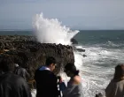 LISBON, PORTUGAL - NOVEMBER 15: Waves break along the coast of Lisbon as the ocean is agitated by wind and waves at during depression "Claudia" on November 15, 2025 in Cascias, Portugal. Roads blocked, trains stopped, and some districts being on high alert in the country due to meteorological conditions caused by depression "Claudia". Meteorologists predict that the bad weather will continue over the next few days in continental Portugal. (Zed Jameson - Anadolu Agency)/