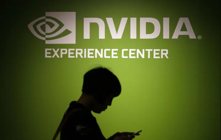 epa08669640 (FILE) - A visitor walks past the Nvidia company logo during a news conference ahead of the COMPUTEX, the largest computer show in Asia, in Taipei, Taiwan, 30 May 2016 (reissued 15 September 2020). US tech giant Nvidia on 13 September 2020 announced it will purchase chip designer Arms for 40 billion US dollar from SoftBank. EPA/RITCHIE B. TONGO *** Local Caption *** 52789390/Ritchie B. Tongo