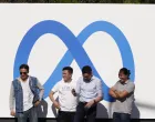 epa09553138 Visitors take picture of billboard sign featuring a new logo and name 'Meta' in front of Facebook headquarters in Menlo Park, California, USA, 29 October 2021. EPA/JOHN G. MABANGLO/John G. Mabanglo