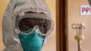 epa10255232 A Ugandan doctor dressing in his Personal Protective Equipments at the Entebbe Regional Referral Hospital Isolation Centre in Entebbe, Uganda, 20 october 2022. A total of 64 positive cases and 24 deaths have so far been confirmed in Uganda since the outbreak of the deadly Ebola virus a month ago in Uganda. EPA/ISAAC KASAMANI/Isaac Kasamani