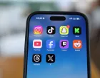Instagram, TikTok, Snapchat, Kick, YouTube, Facebook, Twitch, Reddit, Threads and X applications are displayed on a mobile phone ahead of new law banning social media for users under 16 in Australia, in this picture illustration taken on December 9, 2025. REUTERS/Hollie Adams/Illustration/Hollie Adams